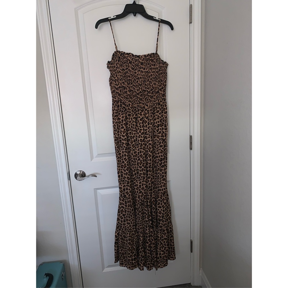 Jumpsuit with flared pant legs.